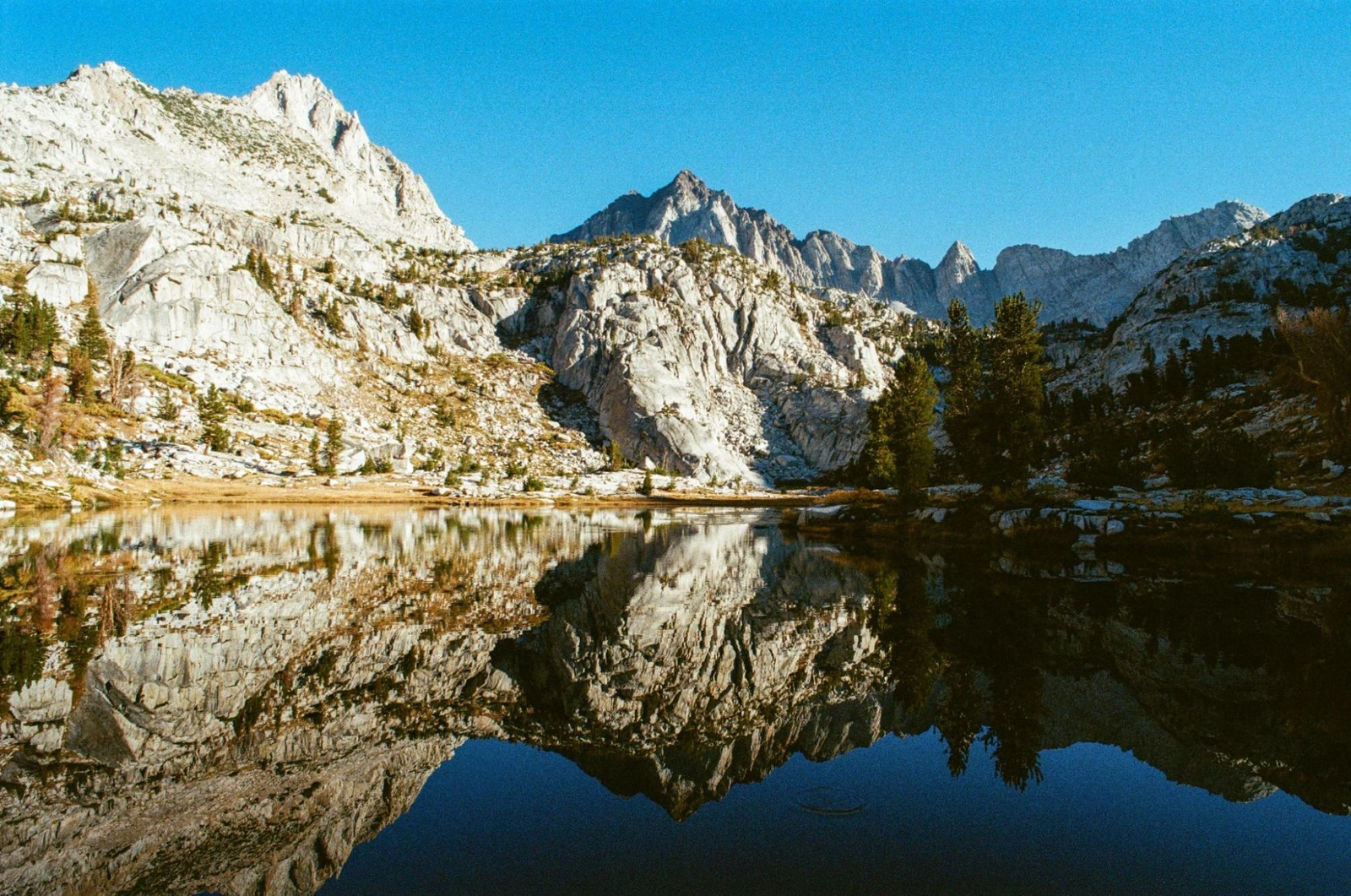 Red and White Mountain reflected in Laurel Lake's mirror surface