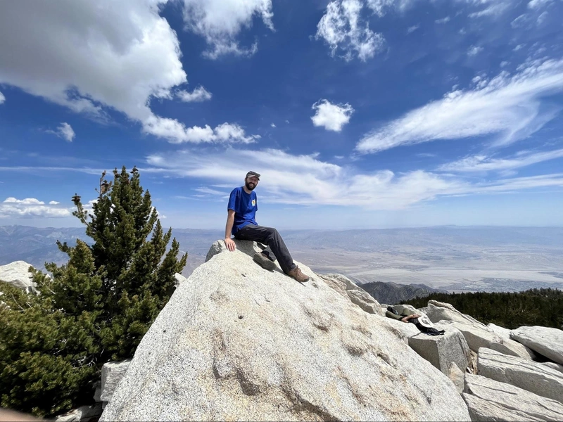 Here’s me sitting on the actual highest point, with Palm Springs etc. behind