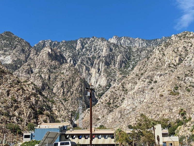 Looking up at the imposing cliffs from the lower tram station